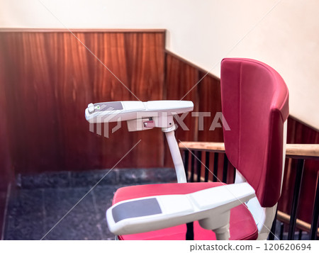 Empty Stairlift on Indoor Staircase for Accessibility Empty Stairlift on Indoor Staircase for Accessibility 120620694