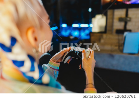 Engaging in an exciting gaming session at a modern entertainment venue 120620761