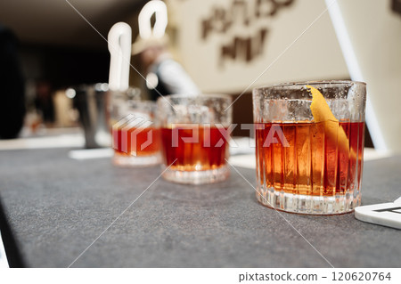 Colorful cocktails served at a modern bar during an evening gathering Colorful cocktails served at a modern bar during an evening gathering 120620764