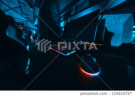 Gaming setup with illuminated keyboard and mouse in a dark environment 120620787