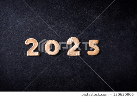 Festive New Year cookies in shape of 2025 120620906