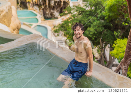 Male tourist at the hot springs of Grutas Tolantongo, Mexico. Adventure, relaxation, and natural wellness concept 120621551