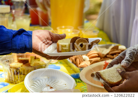 Person receiving food Person receiving food 120622022