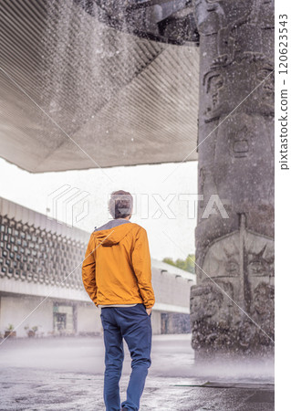 Male tourist exploring the National Museum of Anthropology in Mexico City. Cultural heritage and historical exploration concept Male tourist exploring the National Museum of Anthropology in Mexico City. Cultural heritage and historical exploration concept 120623543