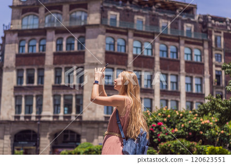 Female tourist in the central square of Mexico City, Zocalo. Cultural exploration, travel, and historic architecture concept 120623551