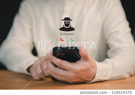 Man answering the incoming call. Phone call was from an unknown number. Concept of scam, fraud with a mobile phone from the criminal. Call center gang or stranger. Hoax person with a fake identity. 120624378