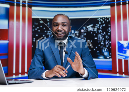 Presenter talking about daily news in newsroom, reporting live information and latest events during news anchor reportage. African american reporter announcing new night show topics. Presenter talking about daily news in newsroom, reporting live information and latest events during news anchor reportage. African american reporter announcing new night show topics. 120624972