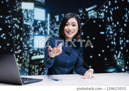 Newscaster addressing latest daily news with information from media outlets and sources for tv content, hosting midnight show. Asian woman presenter creating newscast report. Newscaster addressing latest daily news with information from media outlets and sources for tv content, hosting midnight show. Asian woman presenter creating newscast report. 120625035
