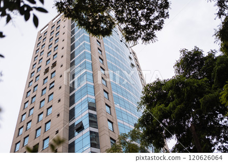 Modern office building surrounded by trees in an urban setting Modern office building surrounded by trees in an urban setting 120626064