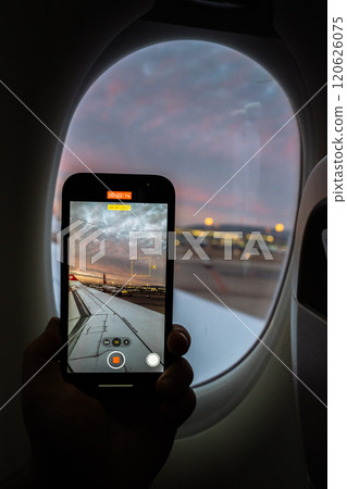 Capturing a sunset view from an airplane window with a smartphone 120626075