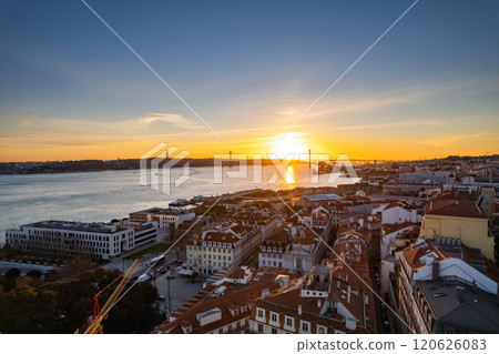Breathtaking sunset over Lisbon with river views and colorful rooftops Breathtaking sunset over Lisbon with river views and colorful rooftops 120626083