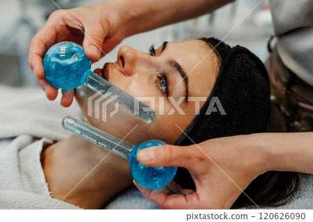Skin treatment session with cooling tools at a spa during the day 120626090