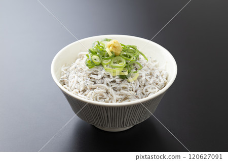 Boiled whitebait bowl on a black background Boiled whitebait bowl on a black background 120627091