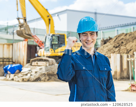 A male worker posing in front of a construction site 120628525