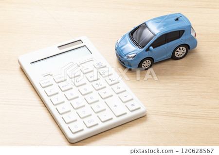 Car and calculator on a table 120628567