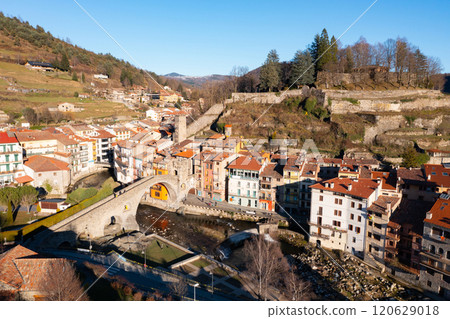 Aerial view of Camprodon in Pyrenees mountains with medieval bridge across Ter river Aerial view of Camprodon in Pyrenees mountains with medieval bridge across Ter river 120629018