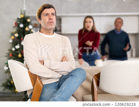 Man and woman quarreling with man 120629228