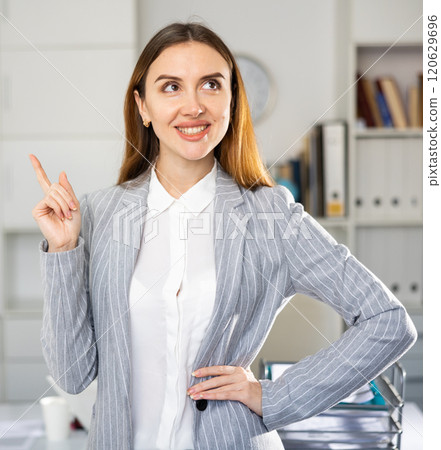 Woman manager expresses various positive emotions in modern office Woman manager expresses various positive emotions in modern office 120629696