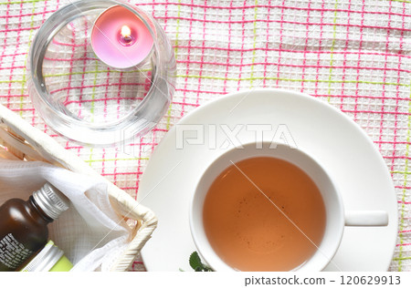 Winter self-care: Aromatherapy candles, aroma oils, moisturizing cream, and delicious herbal tea 120629913