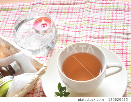 Winter self-care: Aromatherapy candles, aroma oils, moisturizing cream, and delicious herbal tea 120629915