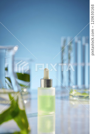 Mock up for cosmetic advertising poster, an unbranded serum bottle placed in center with many lab glassware placed around. Front view, copy space for text Mock up for cosmetic advertising poster, an unbranded serum bottle placed in center with many lab glassware placed around. Front view, copy space for text 120630168