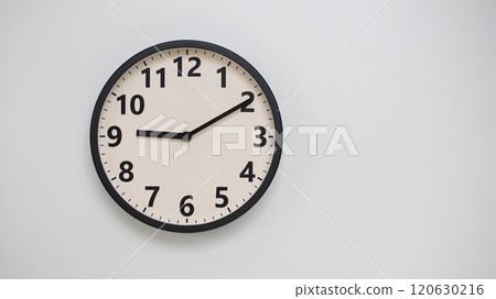 Classic Black-Edged Clock on White Background at 21.10/09.10 - Perfect for Time Management and Text Space Classic Black-Edged Clock on White Background at 21.10/09.10 - Perfect for Time Management and Text Space 120630216