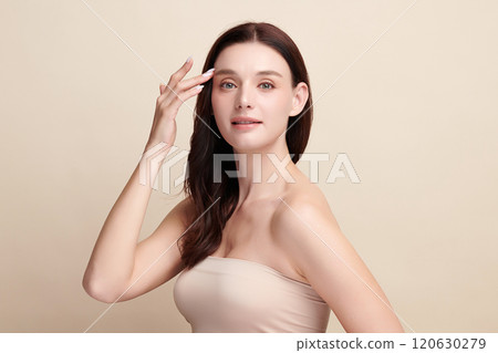 Beautiful young woman with clean fresh skin on beige background, Face care, Facial treatment, Cosmetology, beauty and spa, women portrait. 120630279