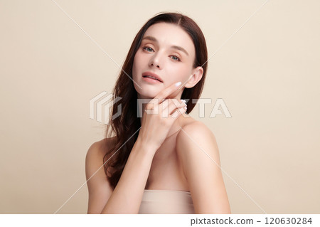 Beautiful young woman with clean fresh skin on beige background, Face care, Facial treatment, Cosmetology, beauty and spa, women portrait. 120630284