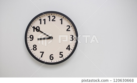 Classic Black-Edged Clock on White Background at 20.50/08.50 - Perfect for Time Management and Text Space Classic Black-Edged Clock on White Background at 20.50/08.50 - Perfect for Time Management and Text Space 120630668
