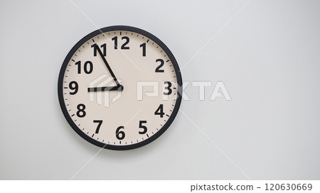 Classic Black-Edged Clock on White Background at 20.55/08.55 - Perfect for Time Management and Text Space Classic Black-Edged Clock on White Background at 20.55/08.55 - Perfect for Time Management and Text Space 120630669