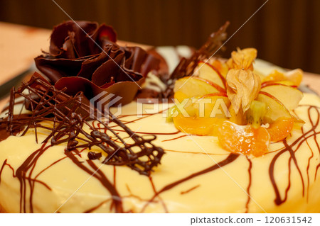 An Elegant Chocolate and Fruit Cake with Beautiful Decorative Toppings for any occasion An Elegant Chocolate and Fruit Cake with Beautiful Decorative Toppings for any occasion 120631542