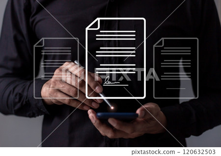 Young man with smartphone mobile hand using a pen touching to sign a Online Business Contract 120632503
