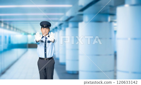 A male security guard stops at an underground passage A male security guard stops at an underground passage 120633142