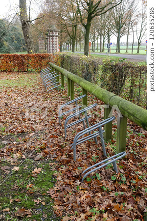 Metal Bike Racks in Autumn Park Metal Bike Racks in Autumn Park 120635286