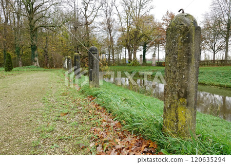Stone Bollards Along a Canal Path in Autumn 120635294