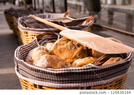 Readymade rolls of freshly baked cereal bread in basket Readymade rolls of freshly baked cereal bread in basket 120636184