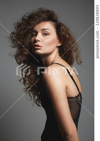beautiful young woman with curly hair. pretty sexual girl in underwear 120636605