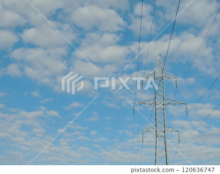 metal tower in power transmission line structure on sky background, industrial equipment for transmitting current over distance 120636747