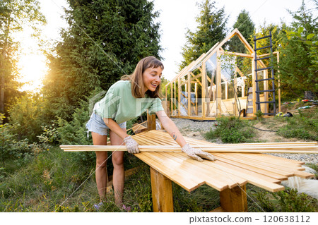 Female Carpenter with Wooden Planks 120638112
