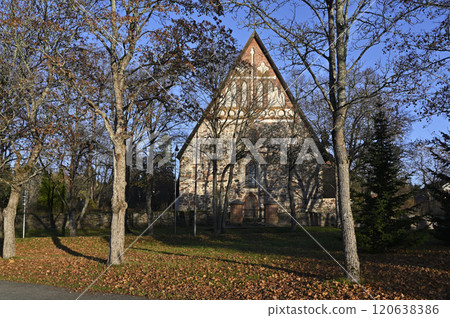 the facade of an old stone church with intricate architectural details 120638386