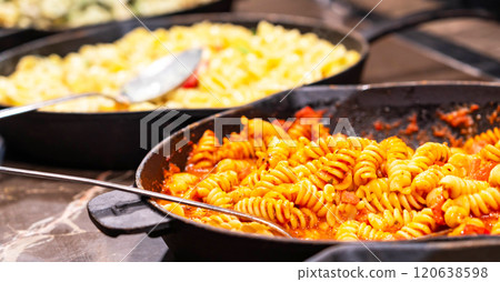 A tempting plate of fusilli pasta coated in savory tomato sauce, capturing the essence of Italian comfort food. A tempting plate of fusilli pasta coated in savory tomato sauce, capturing the essence of Italian comfort food. 120638598