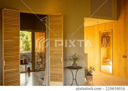 Sunlit Hallway with Wooden Accents 120639016