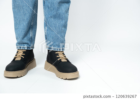 High boots, trendy winter shoes, isolate close-up place for text 120639267