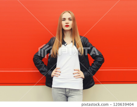 Beautiful modern young blonde woman in black leather jacket, stylish girl posing on city street Beautiful modern young blonde woman in black leather jacket, stylish girl posing on city street 120639404