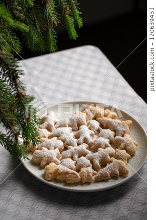 A plate of Christmas dessert with white powdered sugar on top A plate of Christmas dessert with white powdered sugar on top 120639431