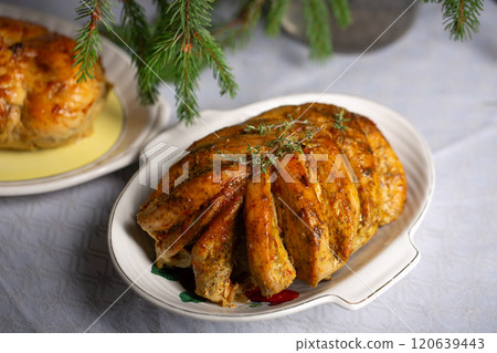 Baked chicken fillet on the bone, an alternative to holiday turkey for the holidays 120639443