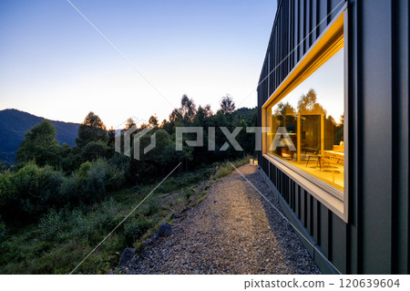 Sunset Reflections on Cabin Window 120639604