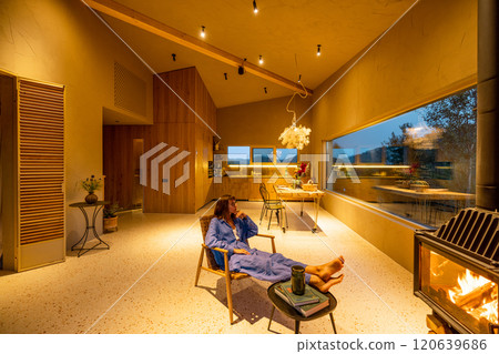 Evening relaxation by the fireplace Evening relaxation by the fireplace 120639686