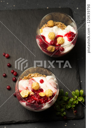 Two glasses of dessert with berries and nuts Two glasses of dessert with berries and nuts 120639798