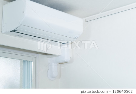 A man checking the air conditioner 120640562